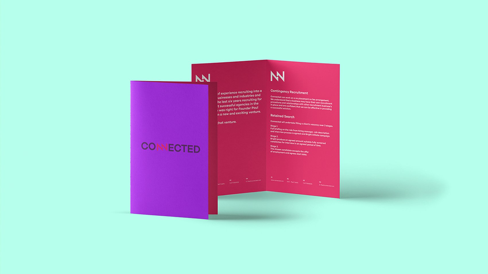 A purple and pink tri-fold leaflet stands open on a light turquoise background. The front displays "CONNECTED," while the inside highlights white text and simple graphics—perfect for showcasing creative that converts and scalable growth strategies for start-ups.