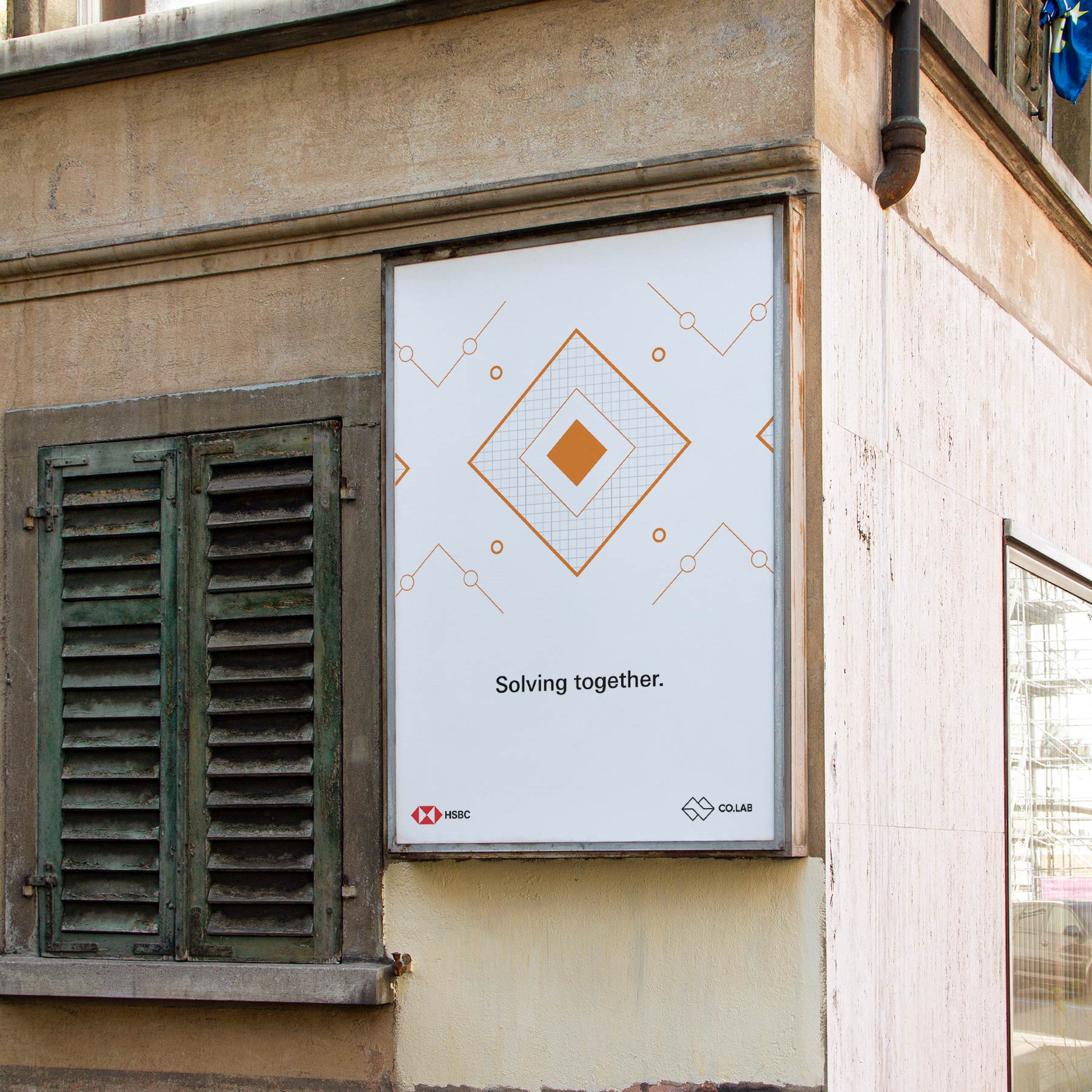 A poster on a building wall features geometric shapes and the text "Solving together." Logos for HSBC and COLAB, a strategically‑led branding studio, are at the bottom. An old green shuttered window is on the left.